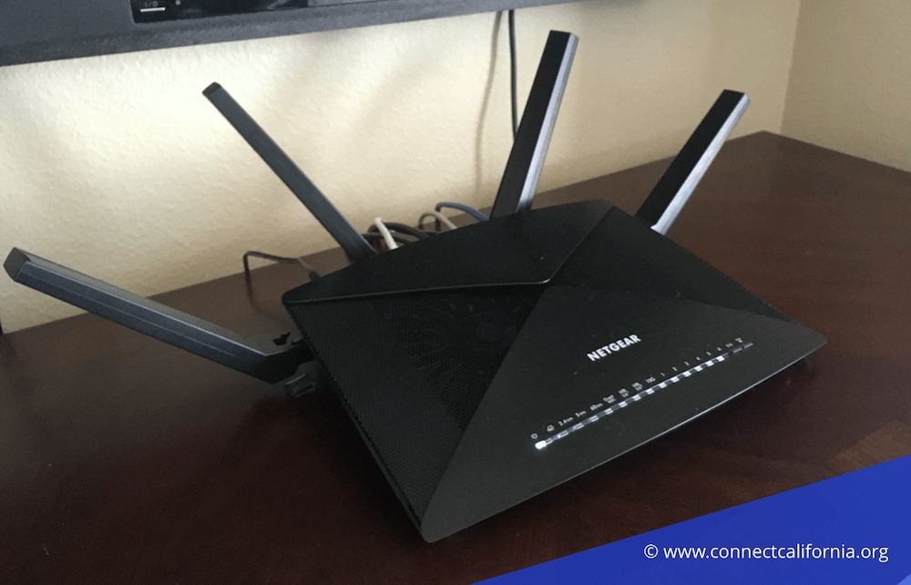 Xfinity compatible router on table.